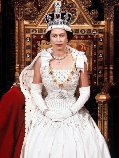 Queen Elizabeth II in a formal portrait wearing the Imperial State Crown